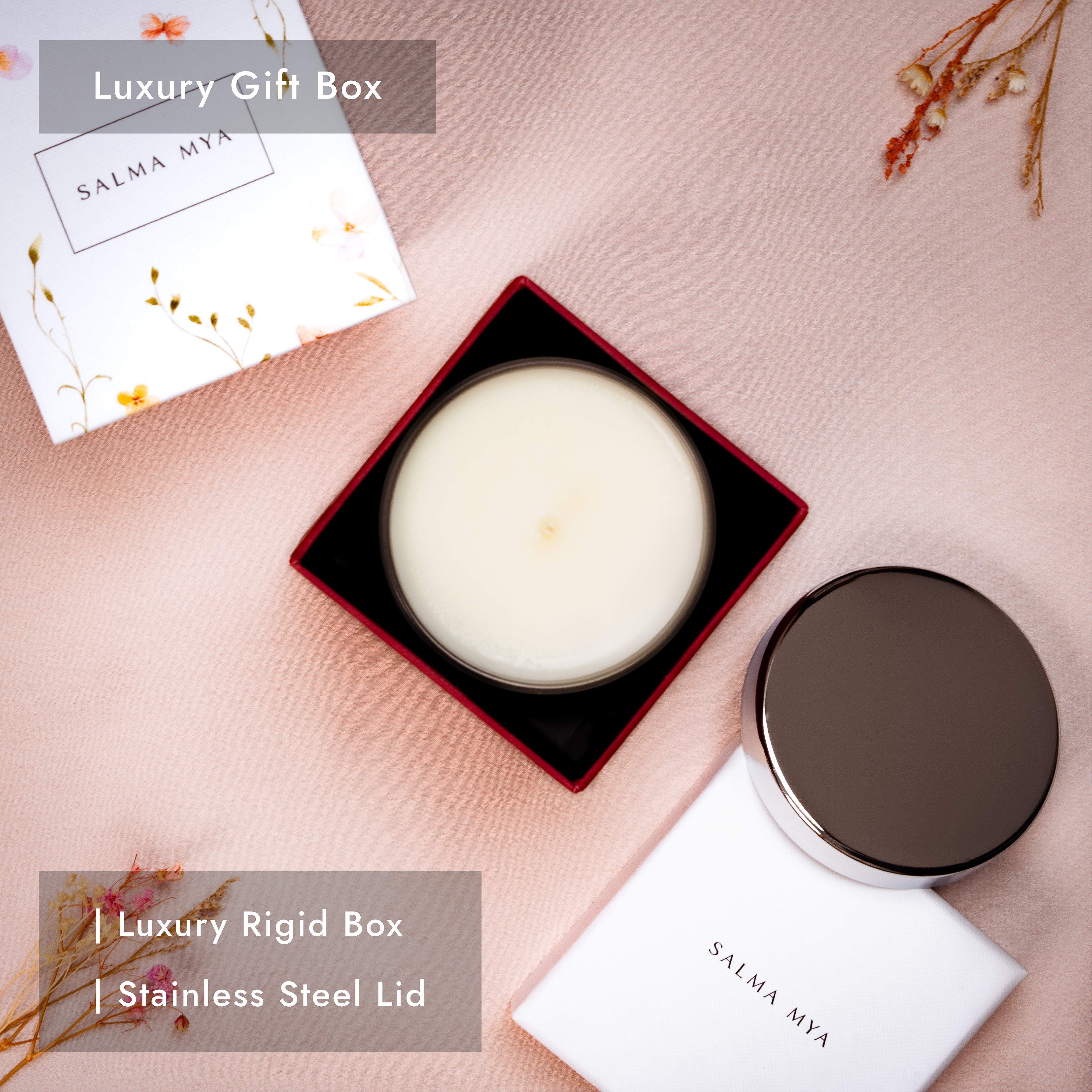Candle in its open red gift box with the polished stainless steel lid resting alongside the floral box