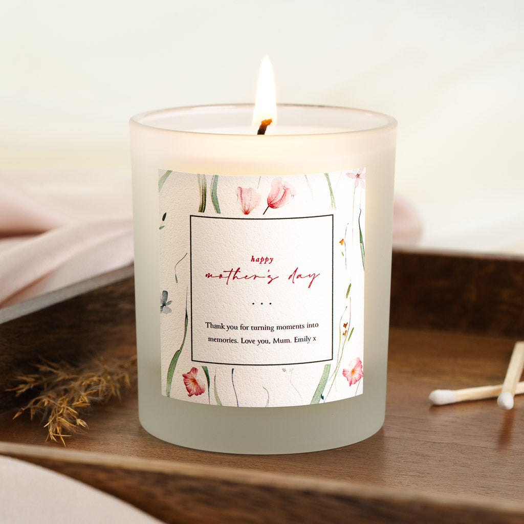 Soft pink and green florals around a black-edged square on a personalised Mother's Day candle