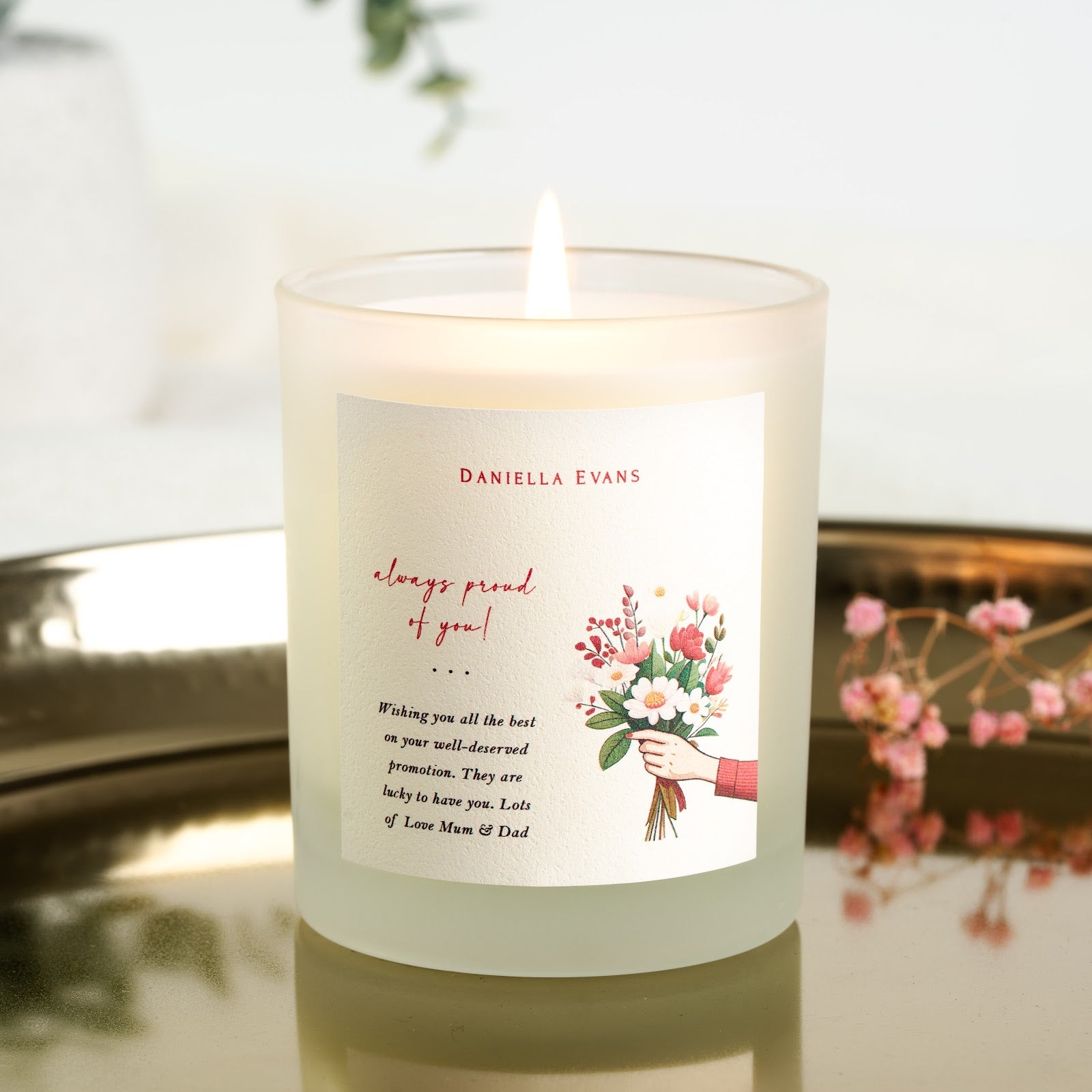 Bouquet illustration beside a proud script message on a personalised congratulations candle