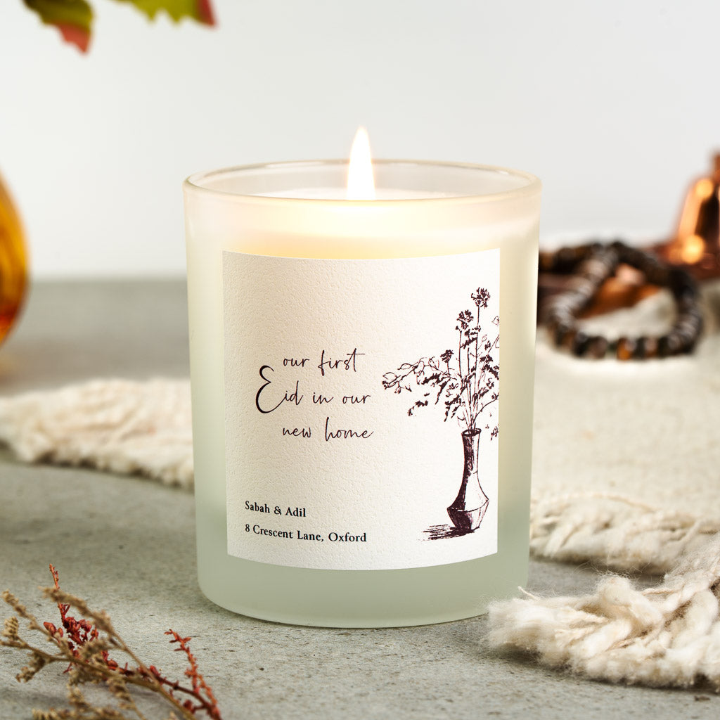 Personalised Eid candle with a flowing black script line on a plain soft white label