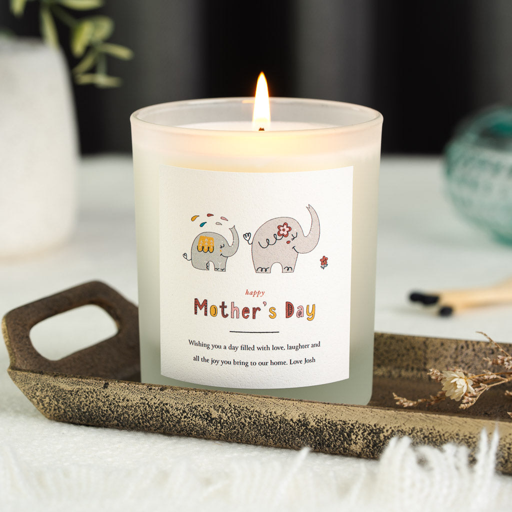 Personalised Mother's Day candle with two pastel elephants, one holding a flower