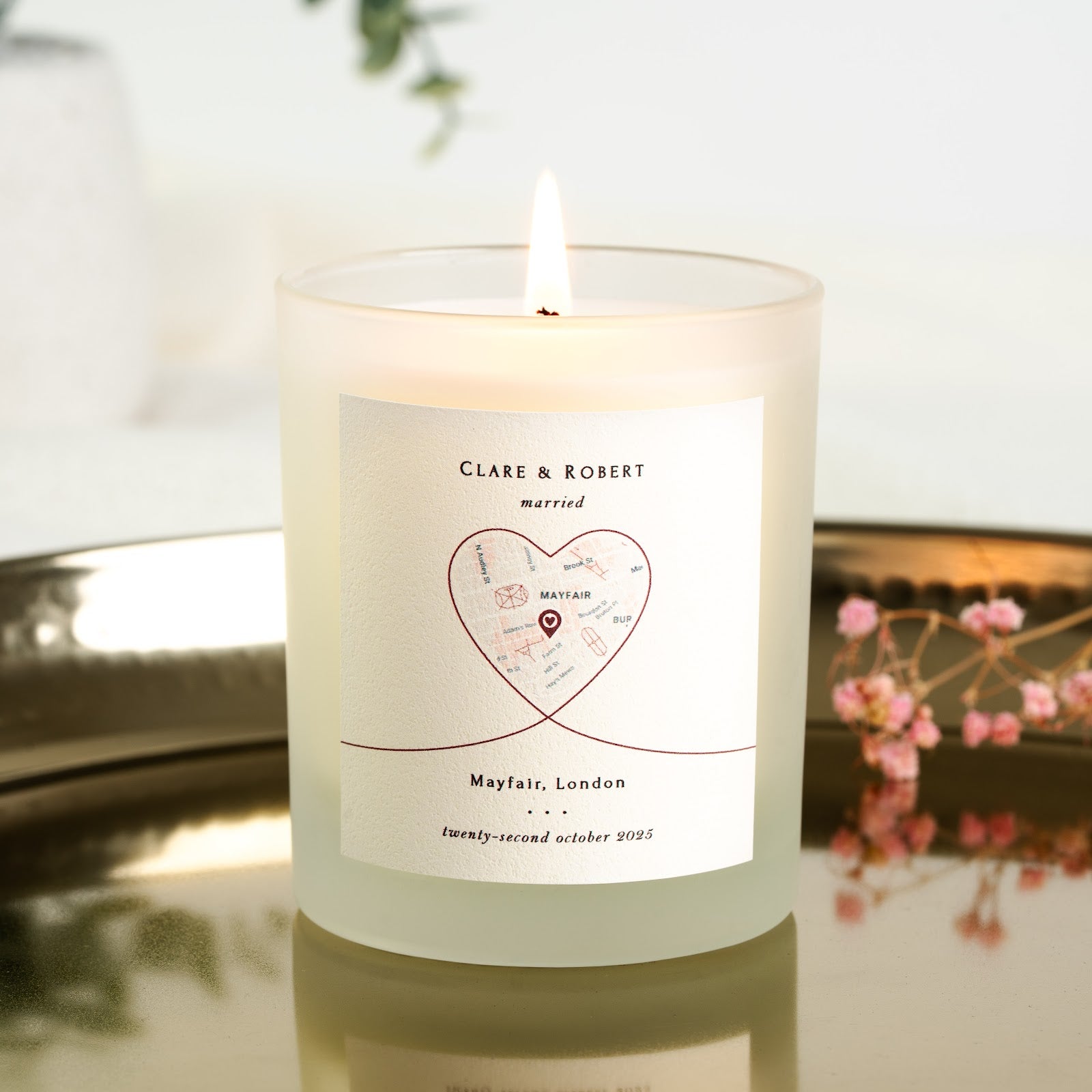 Heart-shaped map with a pin marking the venue on a personalised wedding candle label