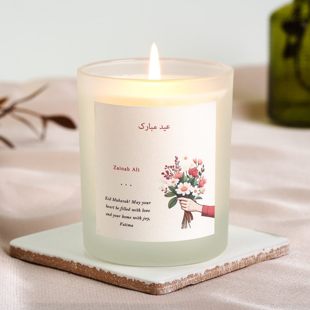 Arabic Eid Mubarak greeting in red script above the name on a personalised candle label
