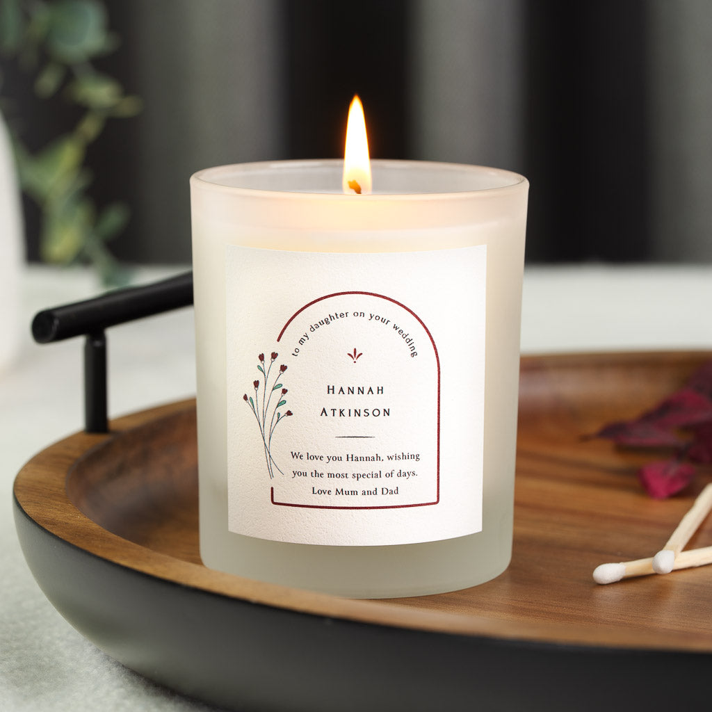 Personalised wedding candle with bold capitals beneath a curved arched header