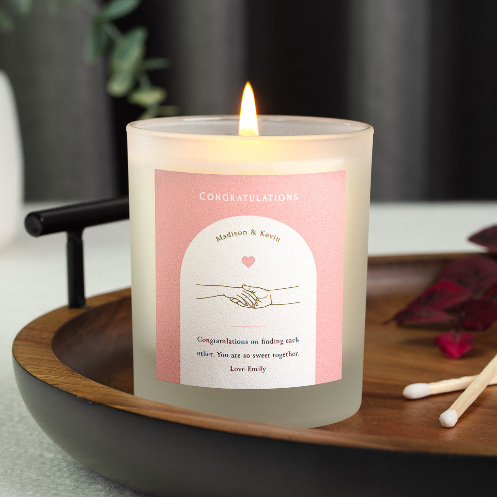 Personalised nikah candle with a white arched cutout on a pink panel