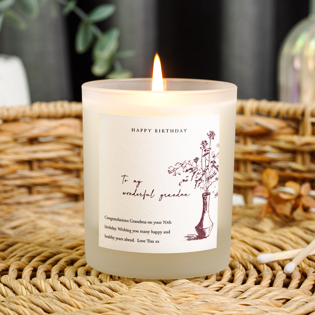 Sketched vase beside a script relationship line on a personalised birthday candle label