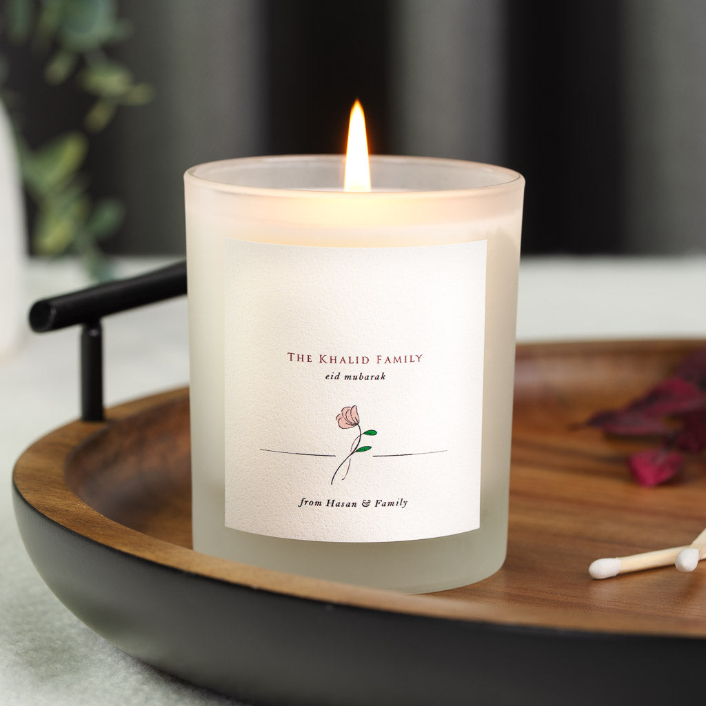 Personalised Eid Mubarak candle with the family surname in red capitals