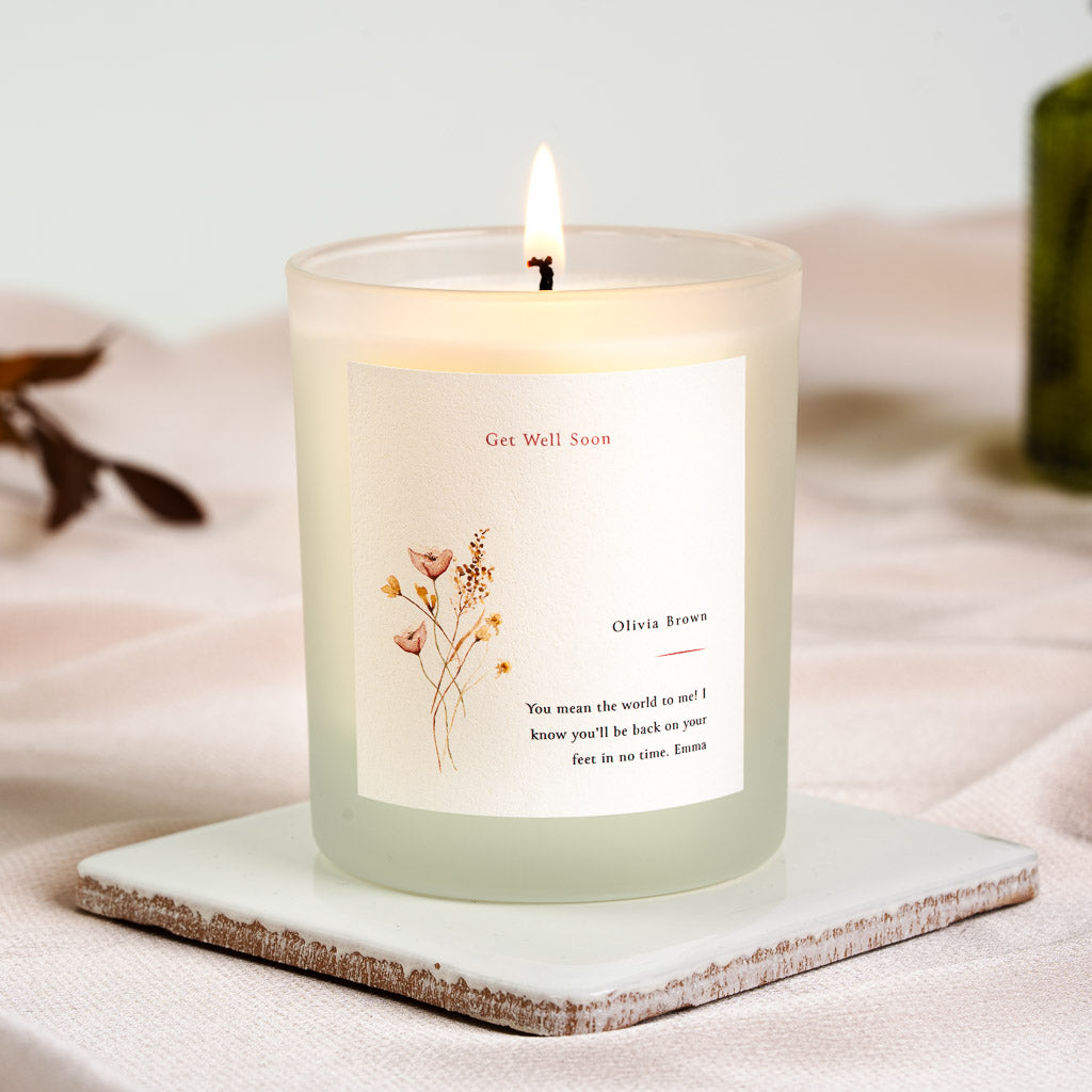 Wildflower illustration set to the left of a get well soon heading on a personalised candle