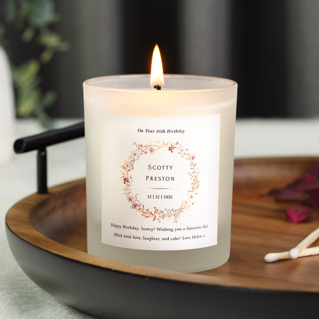 Vintage wreath encircling the name and date of birth on a personalised birthday candle