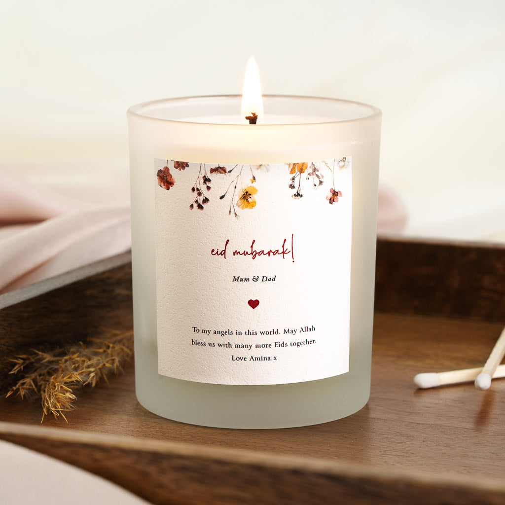 Personalised Eid candle with dried-look flowers hanging along the top edge