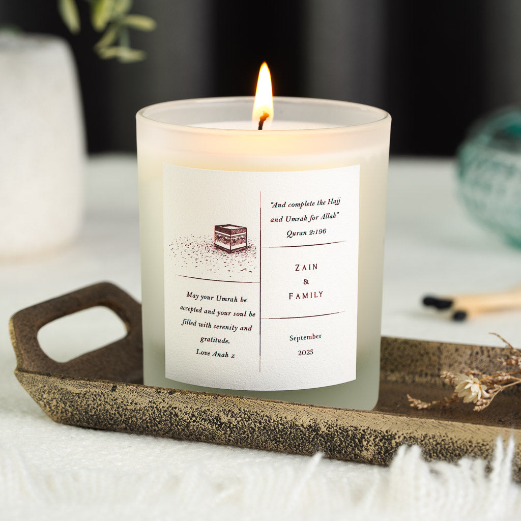 Kaaba sketch beside Surah Al-Baqarah on a personalised Umrah candle label