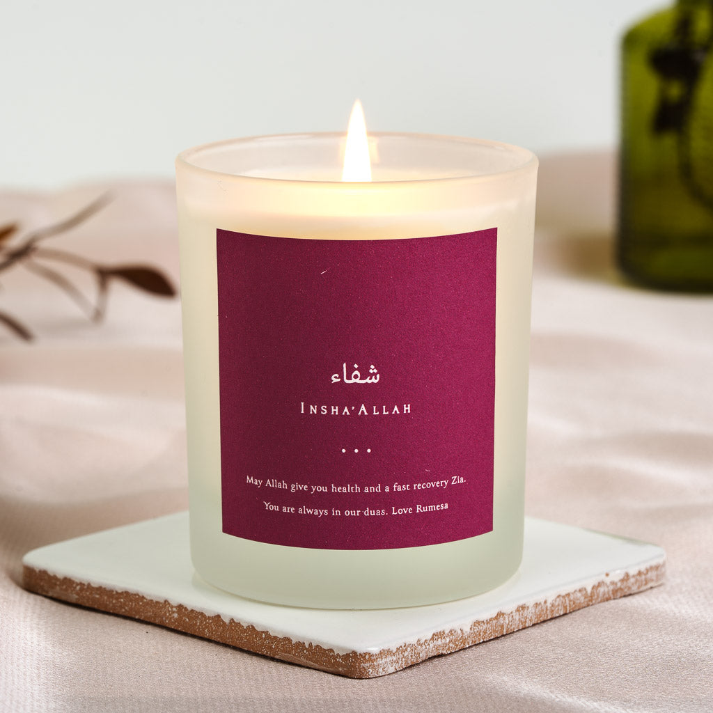 Magenta background holding Shifa in Arabic script on a personalised get well candle