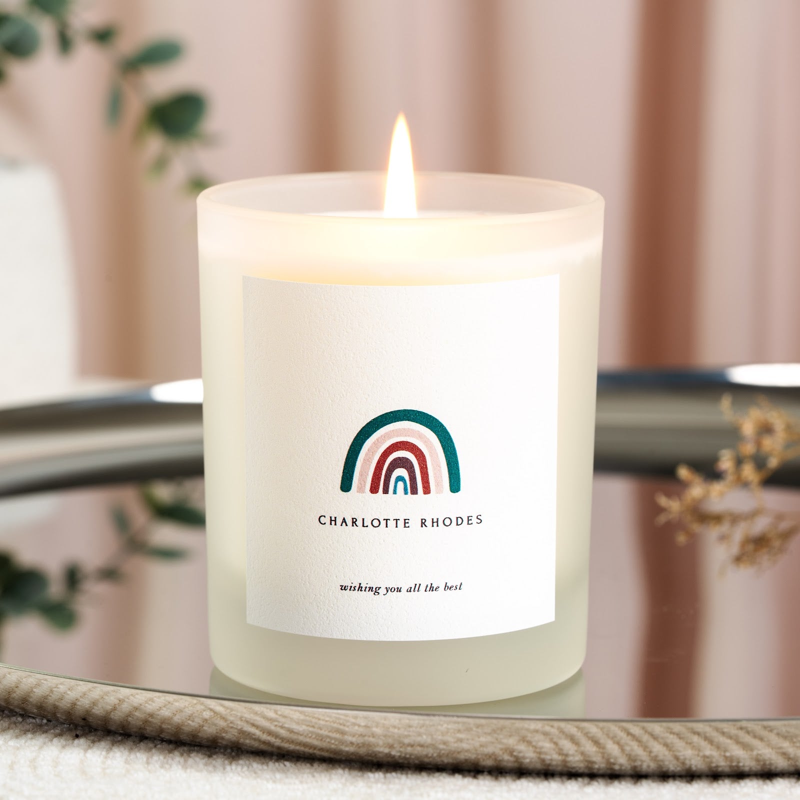 Rainbow illustration above a quiet italic well-wish on a personalised get well candle