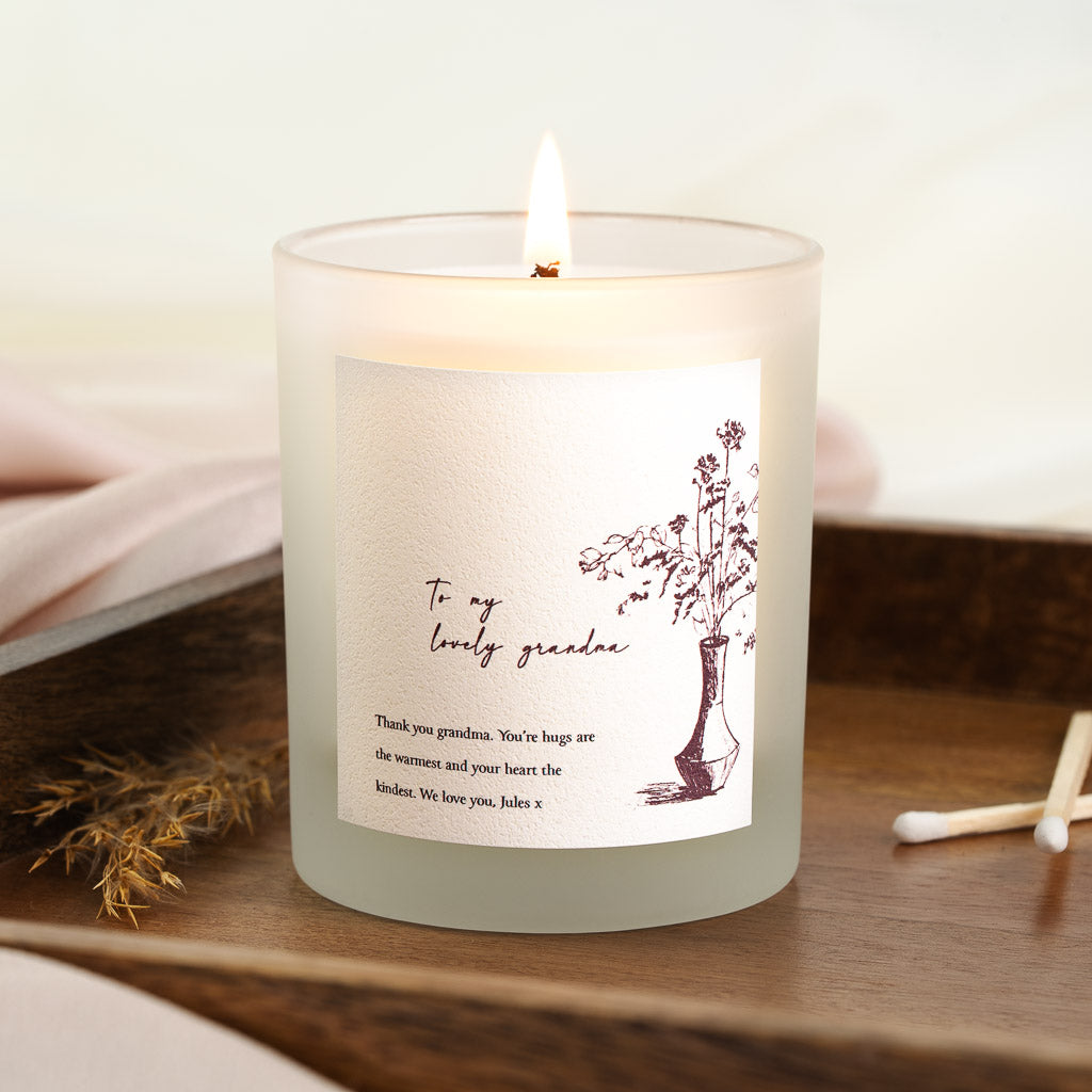 Personalised candle with a deep red sketched vase beside the chosen relationship
