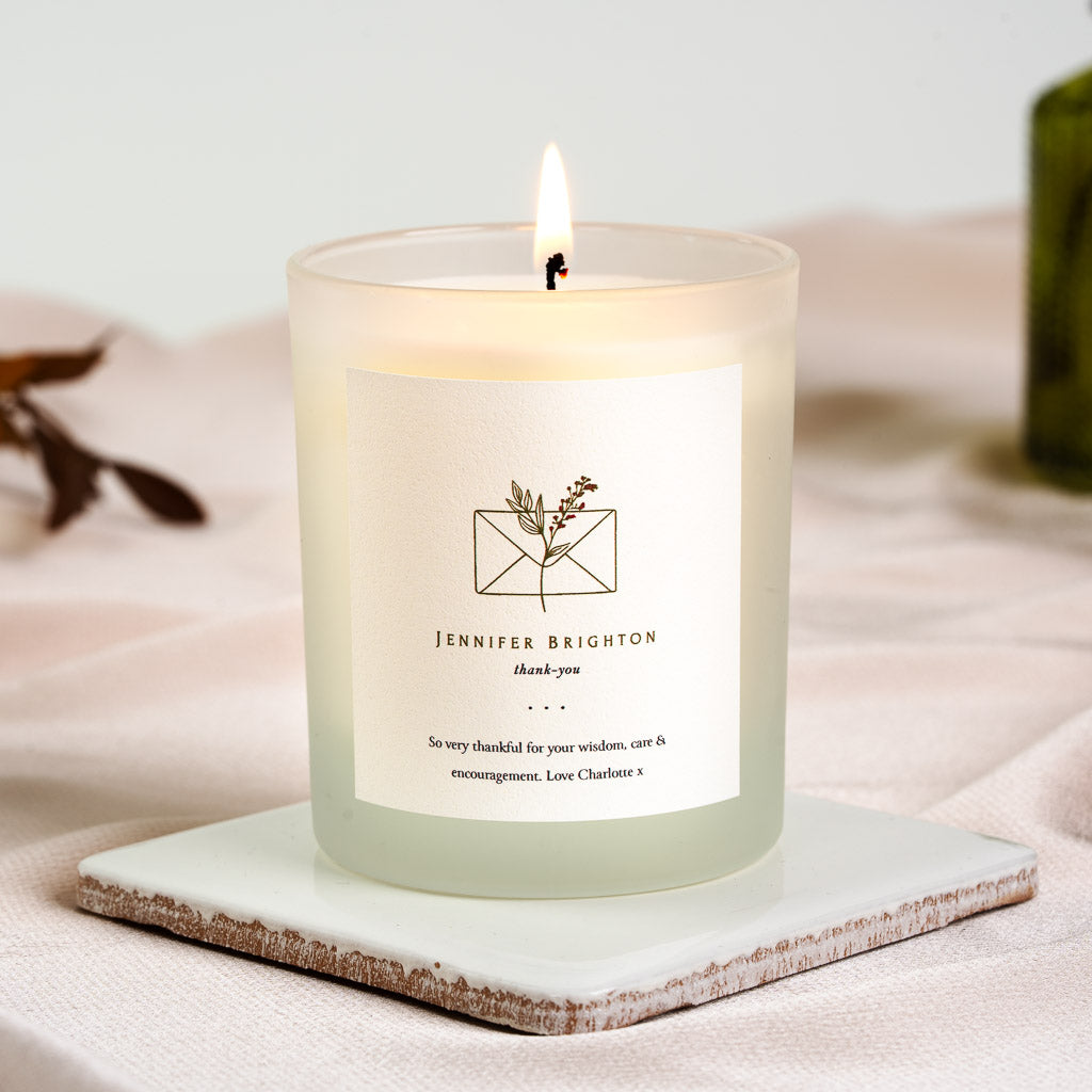 Personalised thank you candle with a line-drawn envelope above the recipient's name