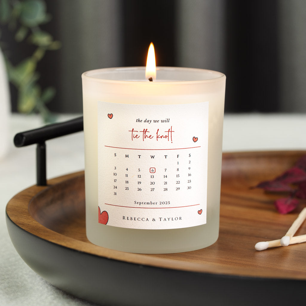 Personalised wedding candle with a month calendar circled in red and hearts in each corner