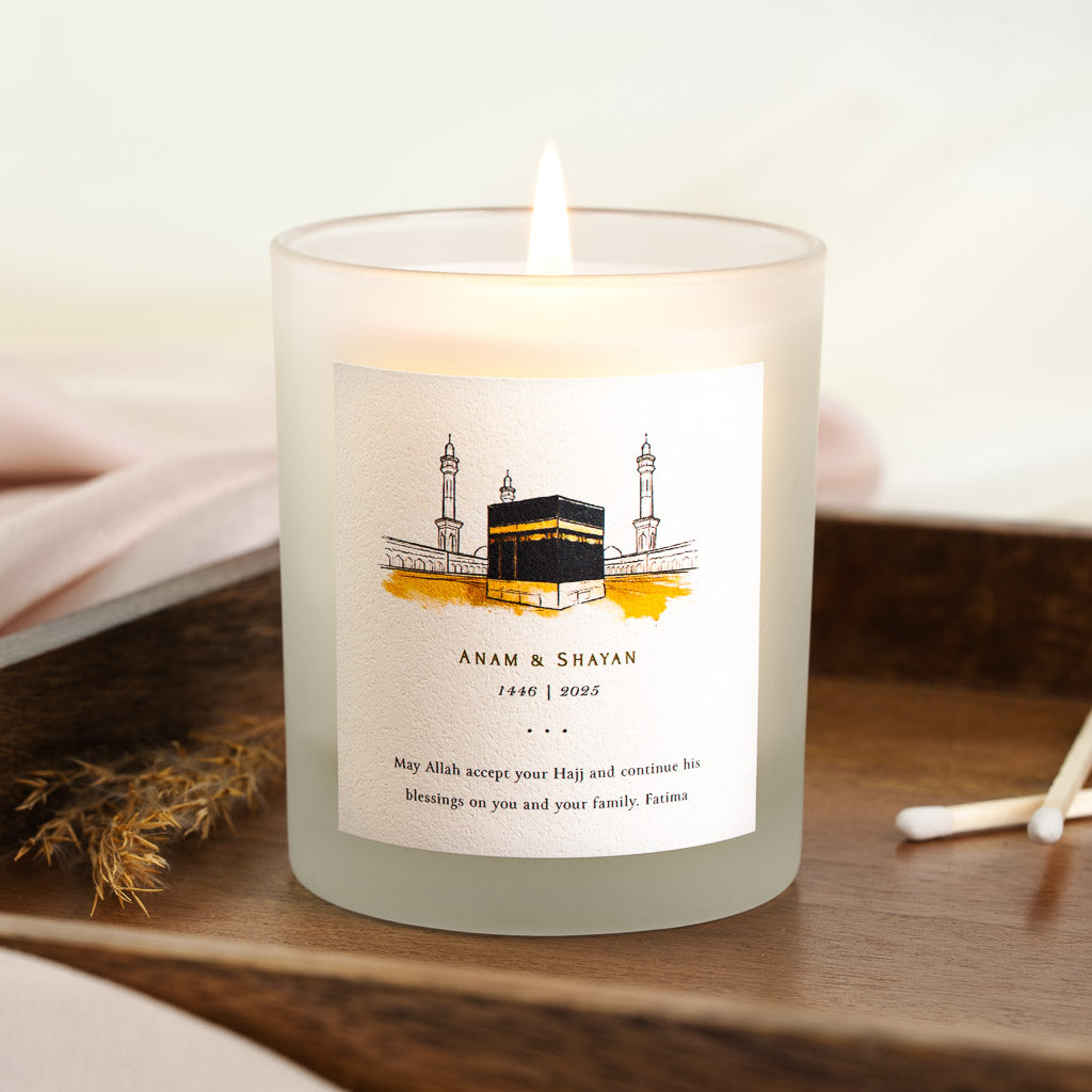 Kaaba painted in black, gold and white on a sand wash on a personalised Hajj candle