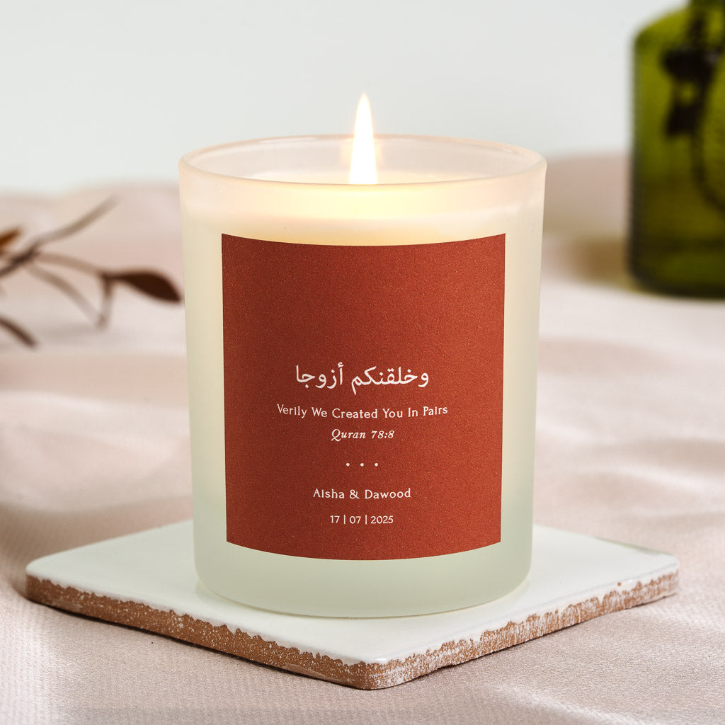 Personalised nikah candle with Surah An-Naba in white script on deep terracotta