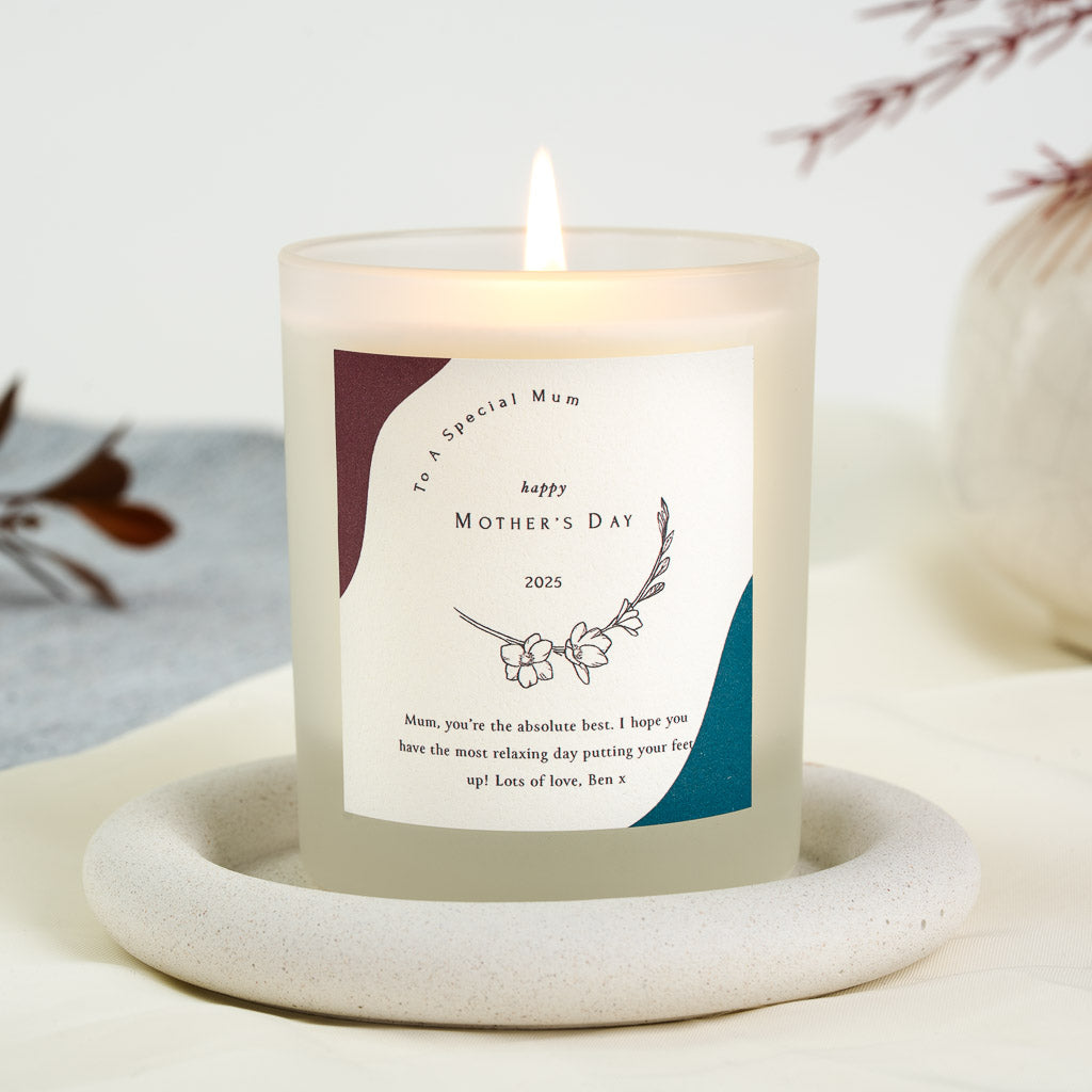 Personalised Mother's Day candle with corner colour blocks and a single-stem flower