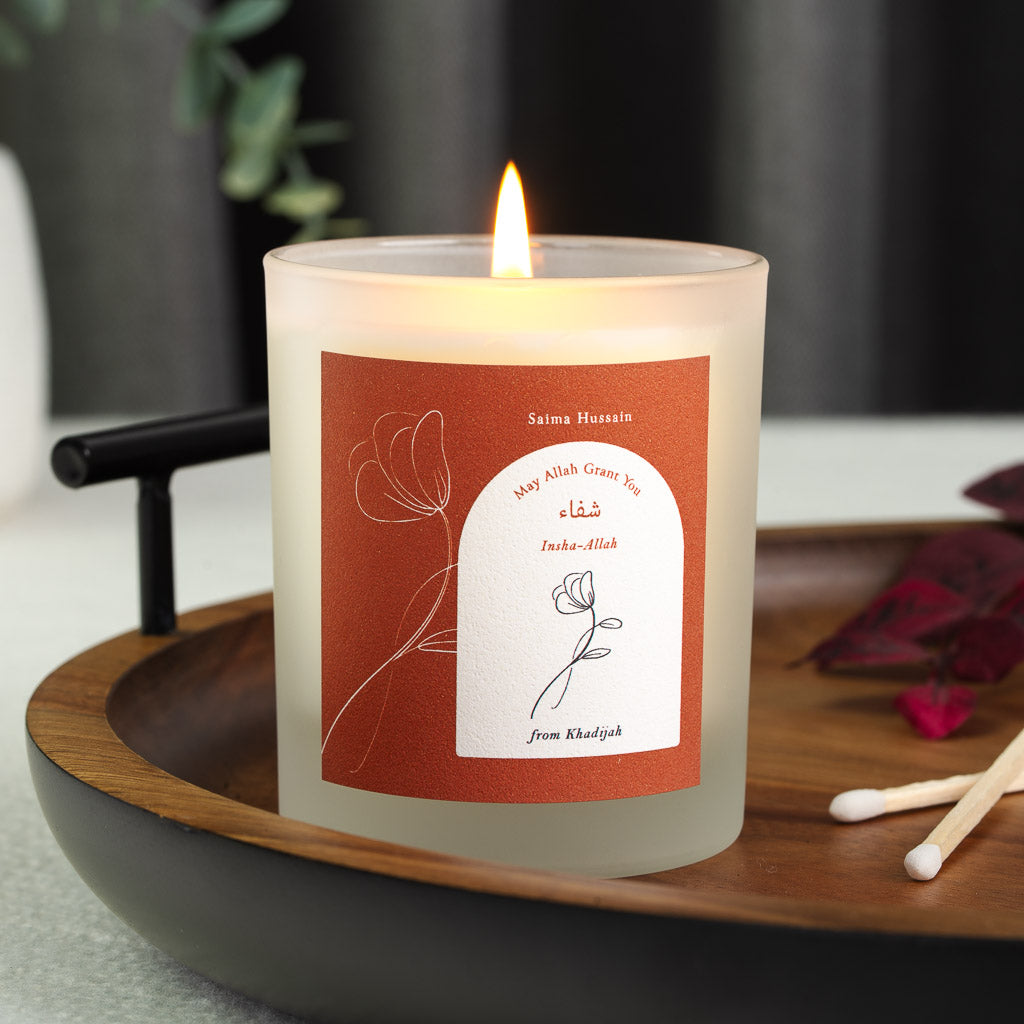 Rust background around an arched white panel on a personalised Islamic get well candle