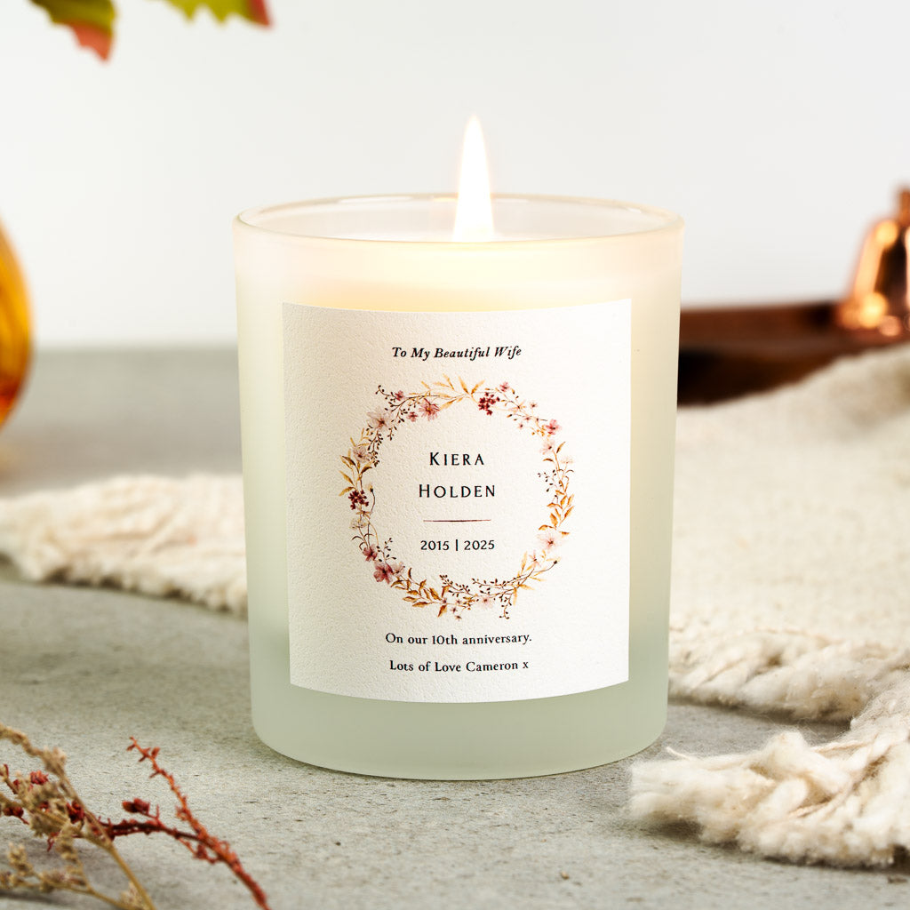 Floral wreath holding the name and wedding years on a personalised anniversary candle
