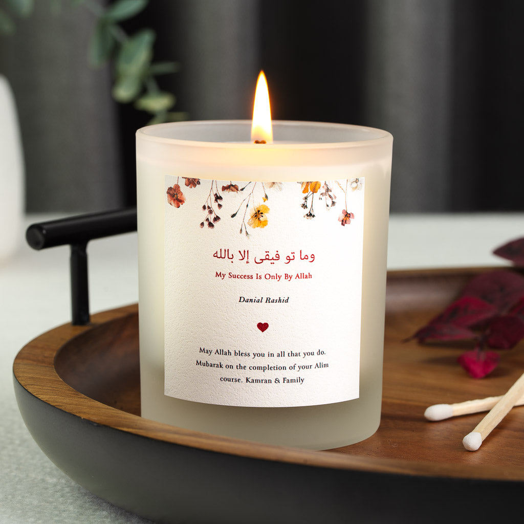 Personalised Islamic graduation candle with pressed autumnal flowers across the top