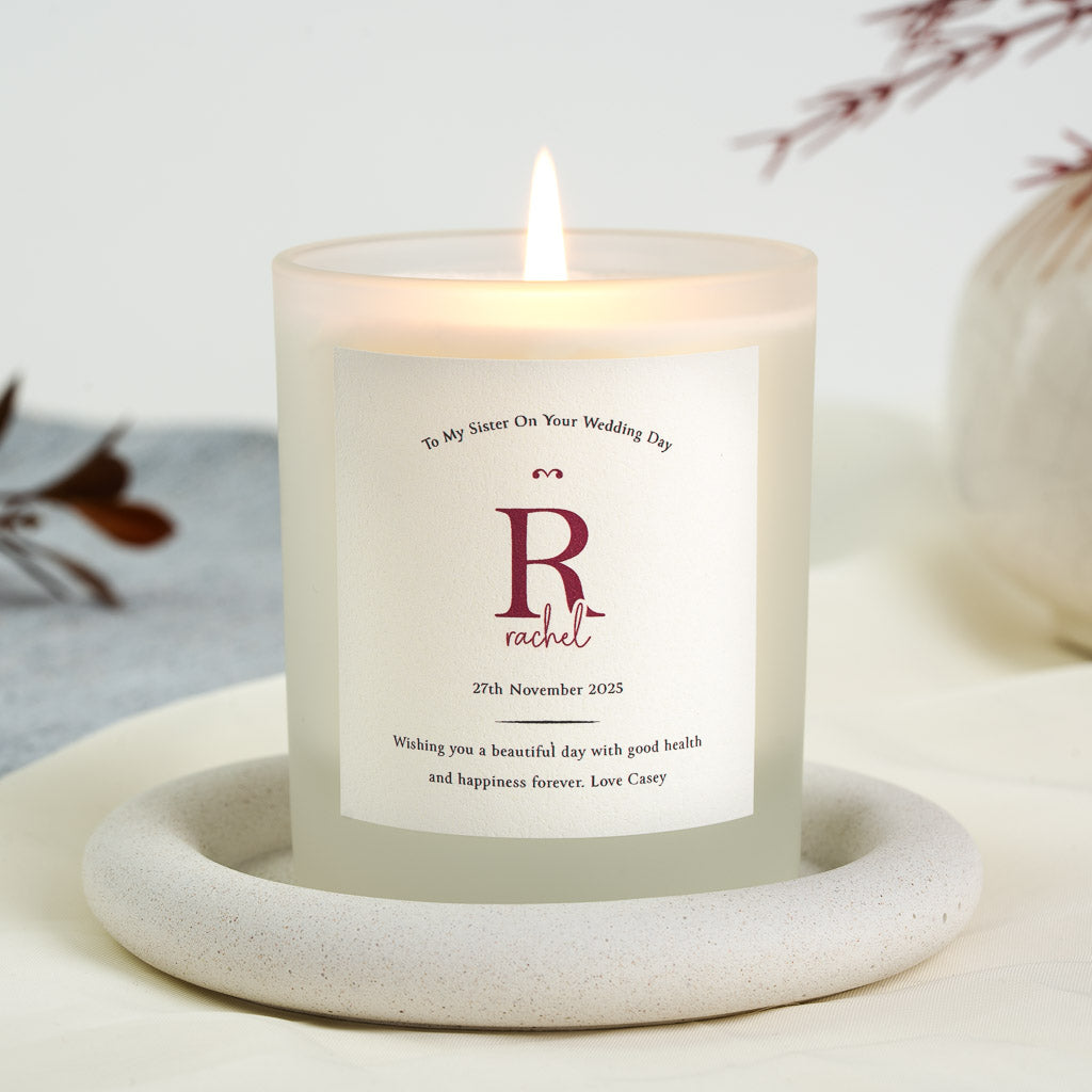 Personalised wedding candle with a monogram and the chosen relationship along the top