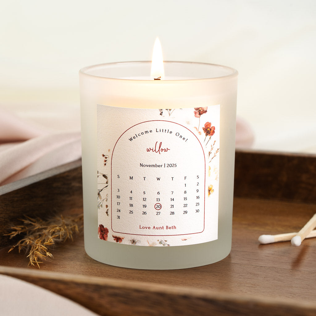Personalised new baby candle with the exact date of birth marked on a full calendar grid