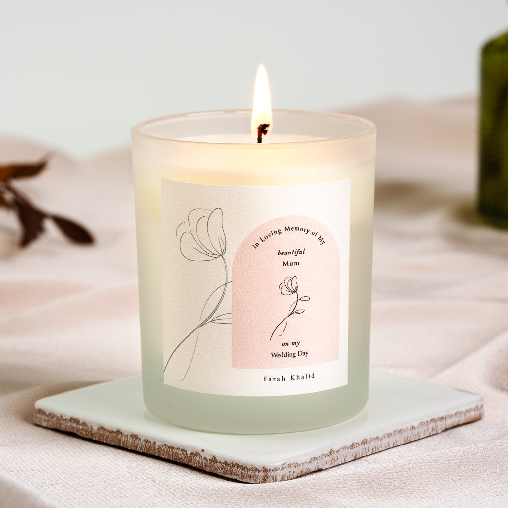 Soft pink arch holding the remembrance line on a personalised wedding day memorial candle