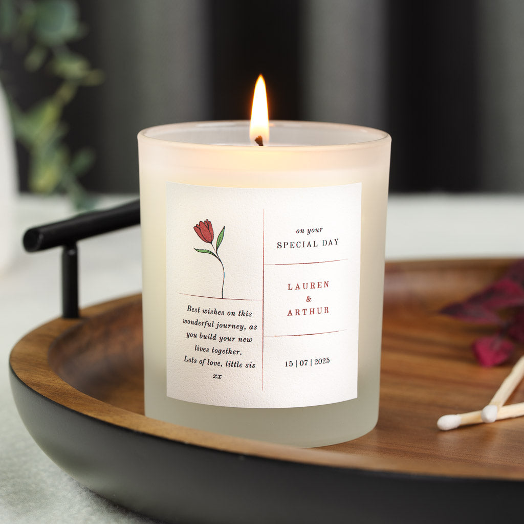 Single red tulip beside on your special day on a personalised wedding candle label