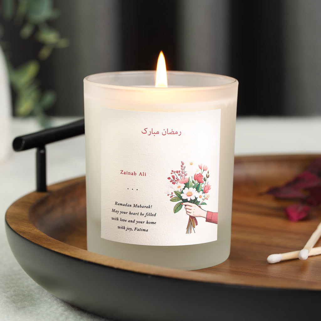 Arabic Ramadan Mubarak greeting in red script above the name on a personalised candle