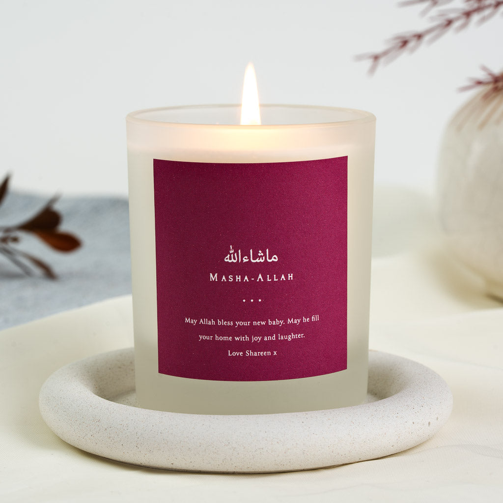 Solid berry panel with Arabic script above its capitalised form on a personalised baby candle
