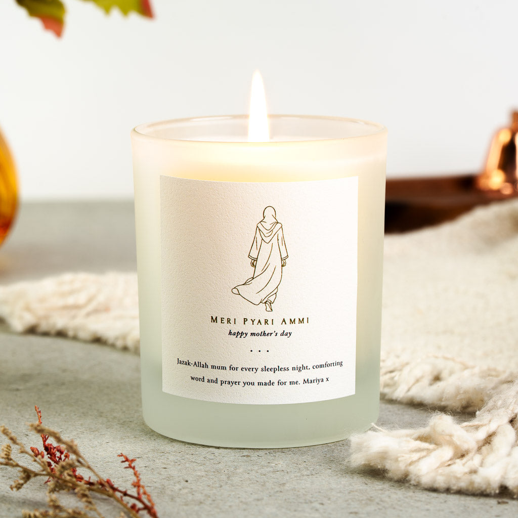 Gold line figure in a hijab walking away on a personalised Islamic Mother's Day candle