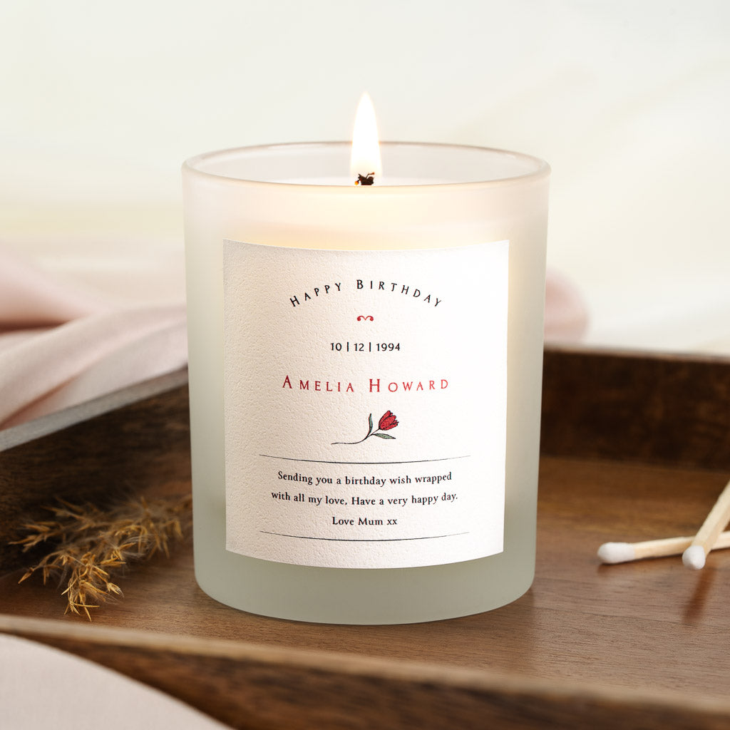 Personalised birthday candle with a red tulip beneath the name in red capitals