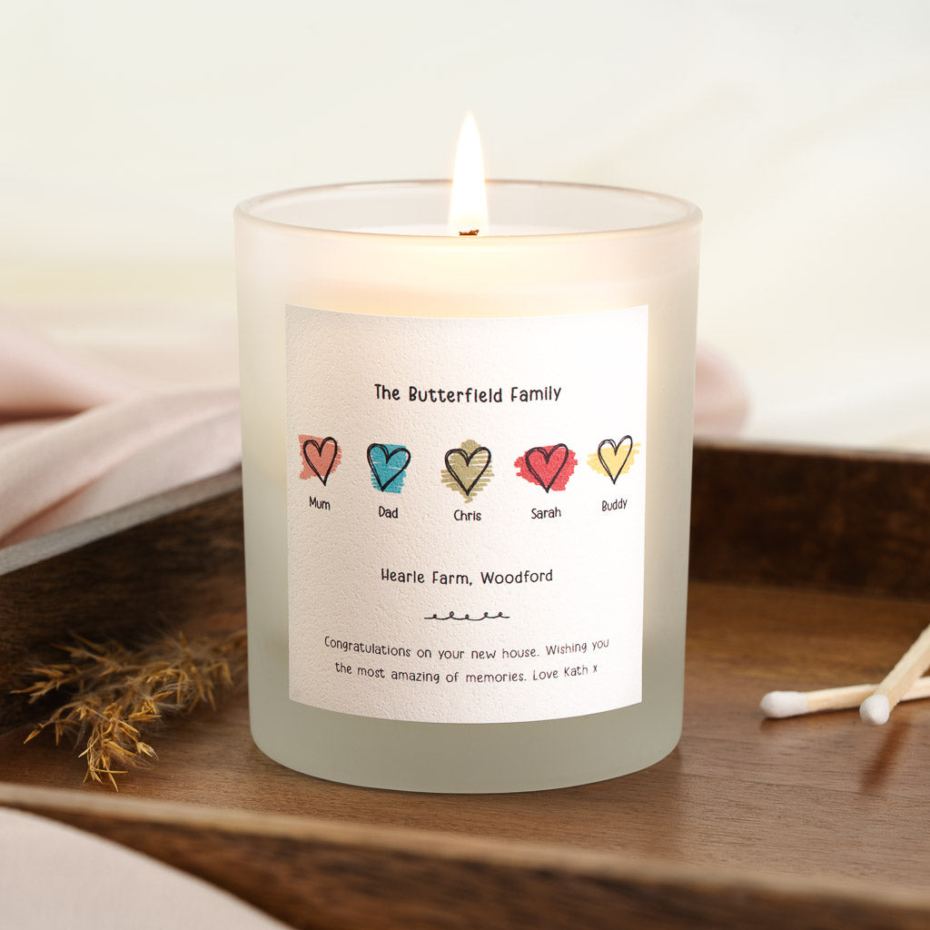 Personalised new home candle with a row of hand-drawn hearts in different colours