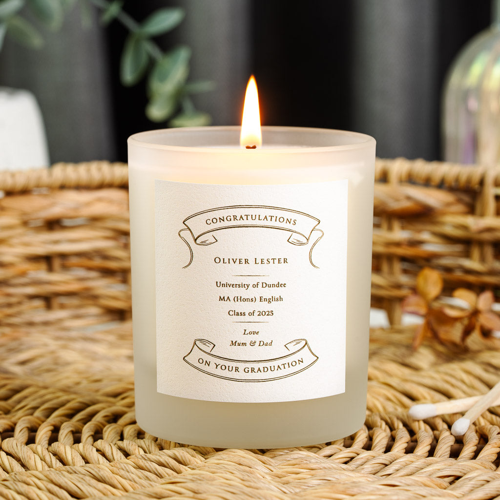 Ornate scroll banners framing the name on a personalised graduation candle label