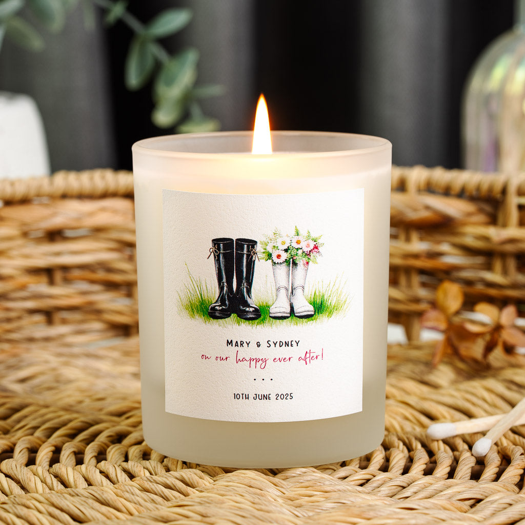 His and hers wellies above red script on a personalised anniversary candle label
