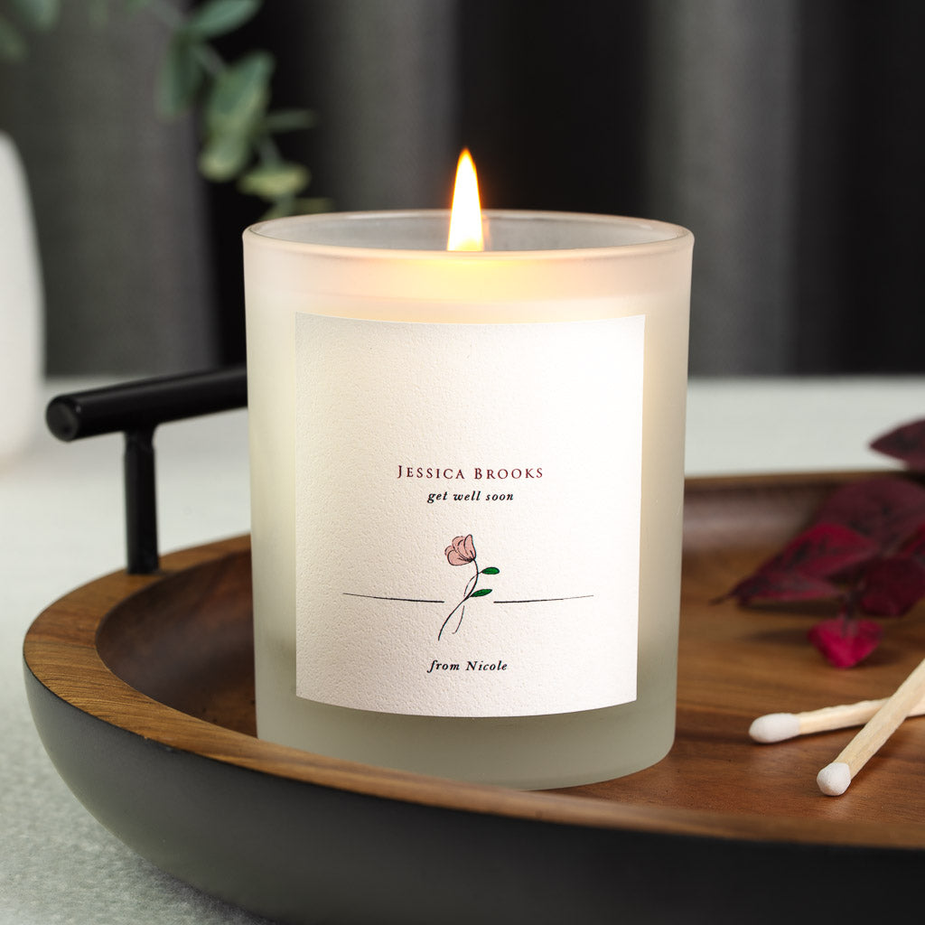 Rose illustration beneath the get well soon heading on a personalised candle label