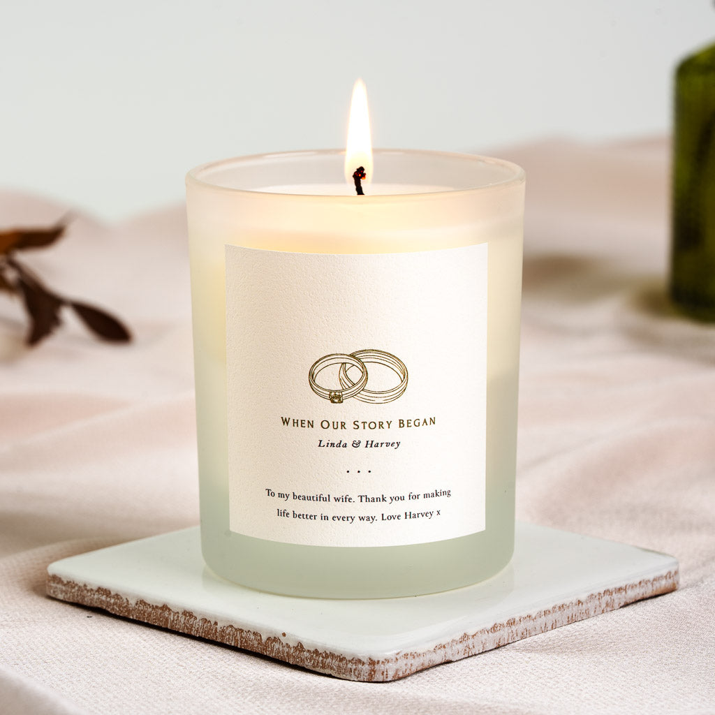 Personalised anniversary candle with when our story began set above the couple's names