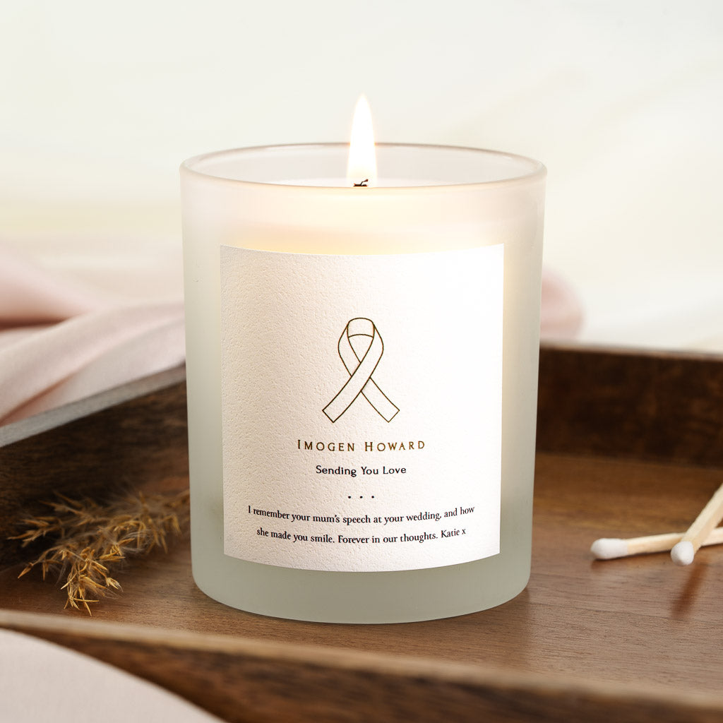 Ribbon illustration above the name and a sending you love line on a personalised candle