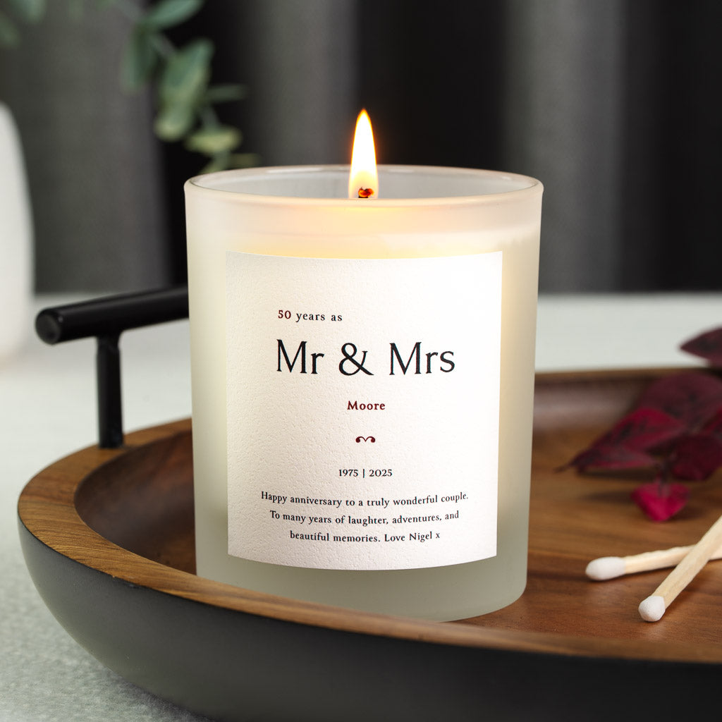 Golden fiftieth year figure above Mr and Mrs on a personalised anniversary candle label