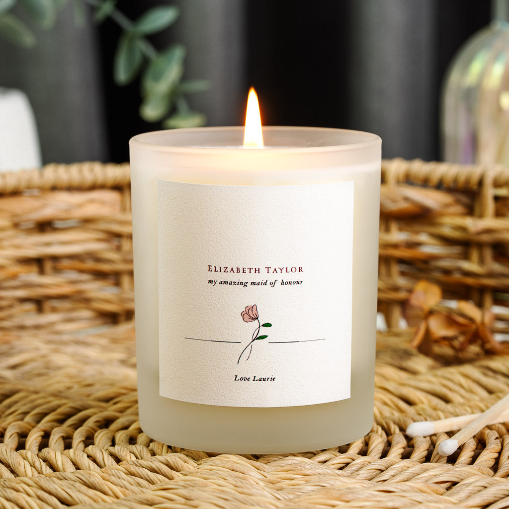 Personalised maid of honour candle with a line-drawn rose beneath bold red lettering