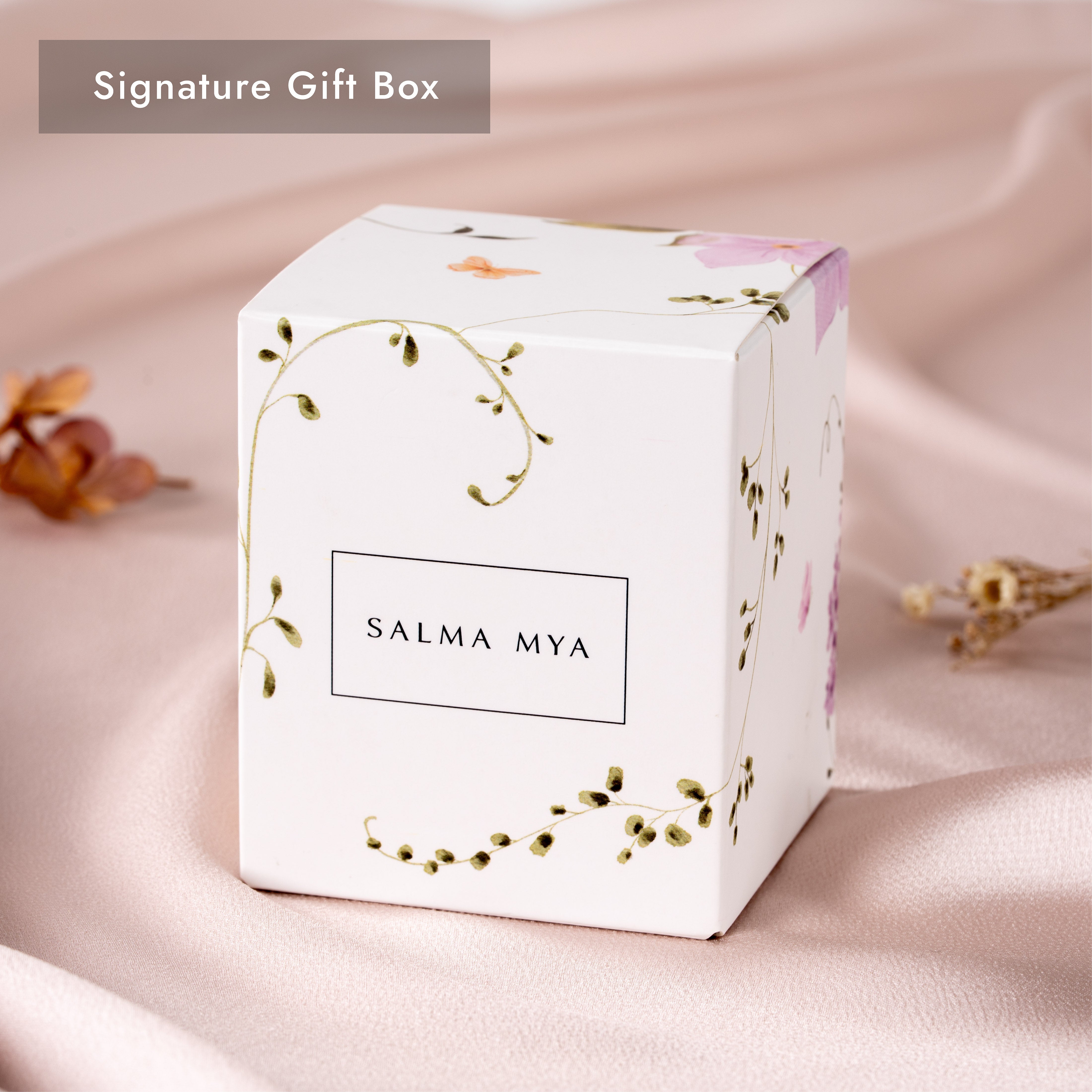 Signature gift box in white with elegant foliage and watercolour florals, SALMA MYA logo on the front