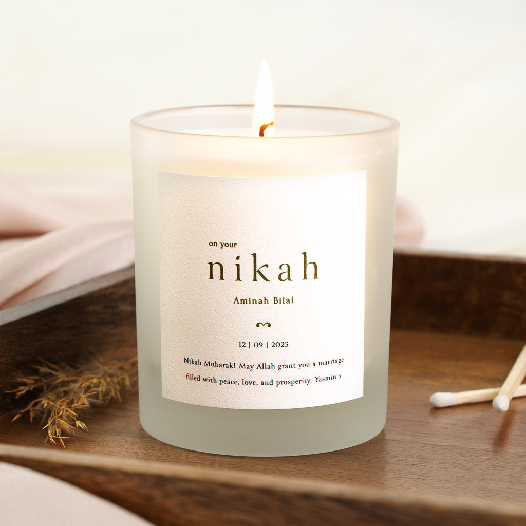 Personalised nikah candle with a spaced lowercase nikah as its focal point