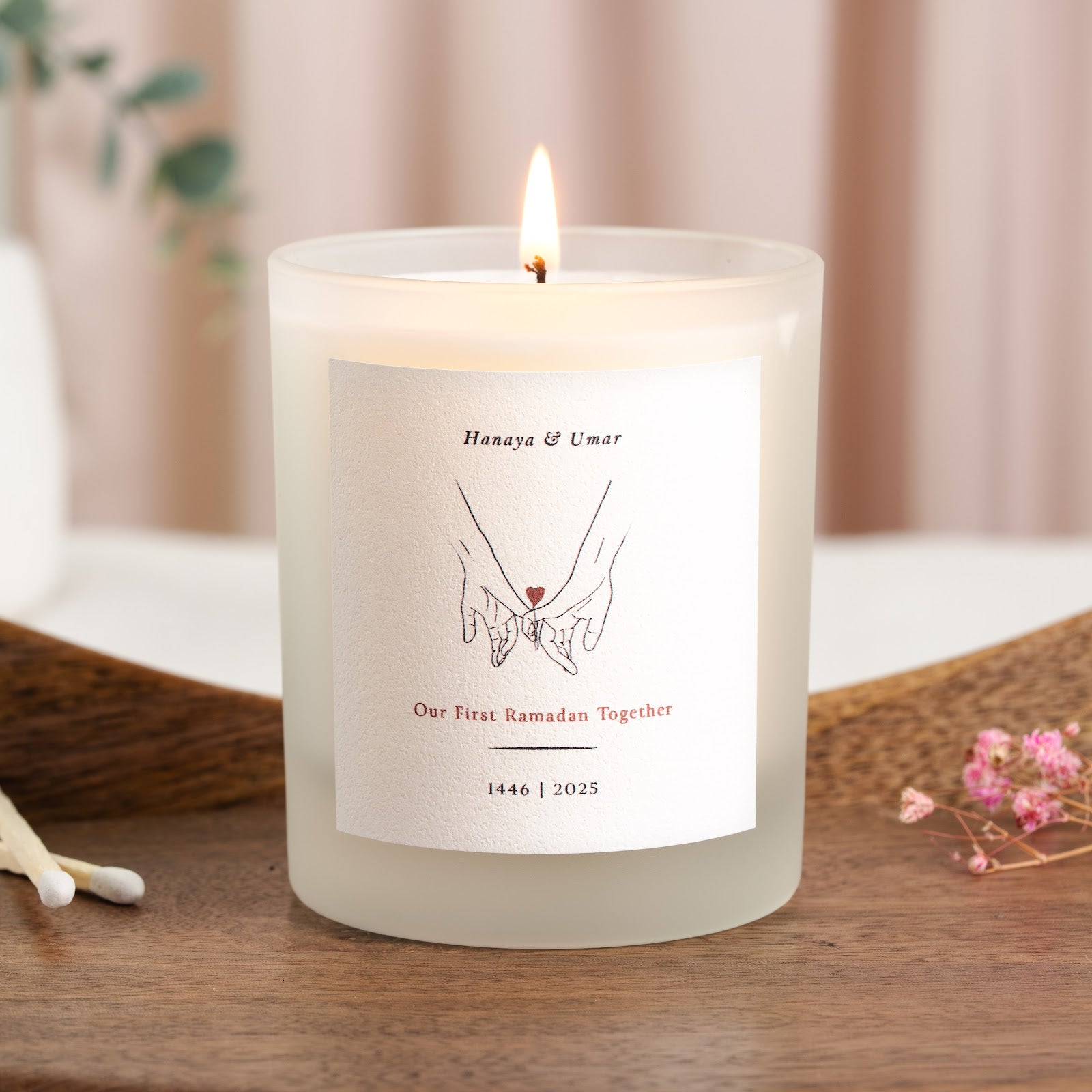 Personalised Ramadan candle with a fine black line drawing of two clasped hands
