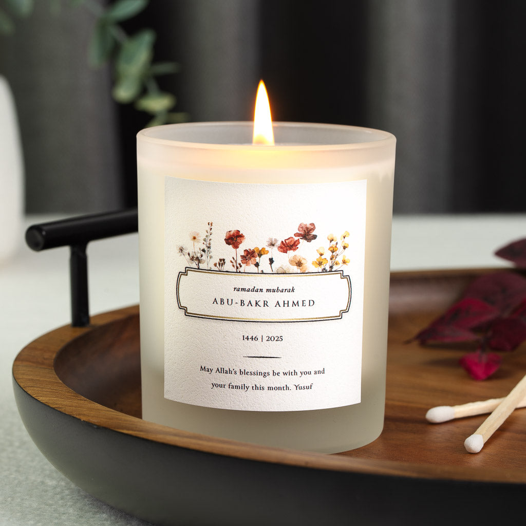 Watercolour wildflowers above a slim double-lined box on a personalised Ramadan candle