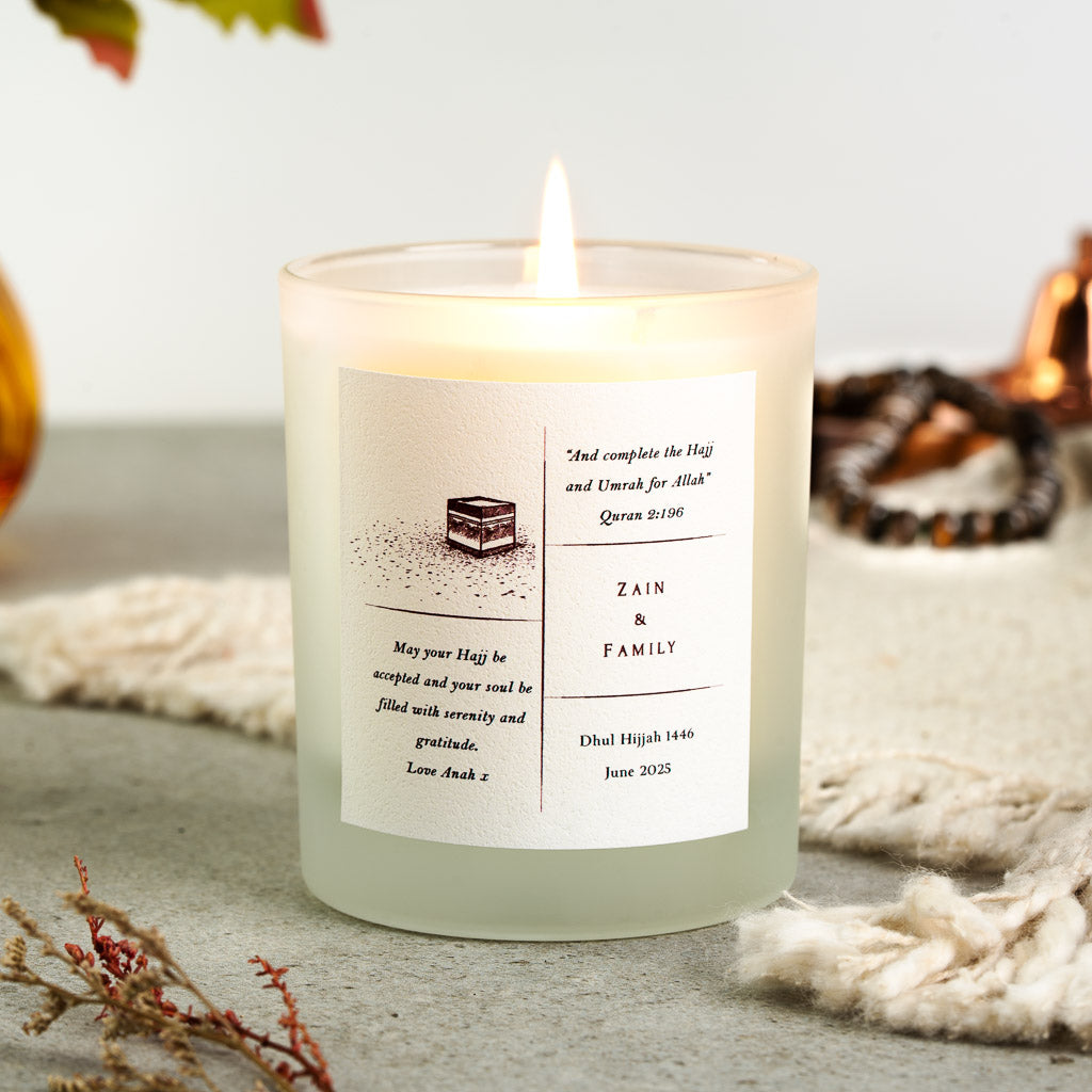 Kaaba sketch beside Surah Al-Baqarah on a personalised Hajj family candle label