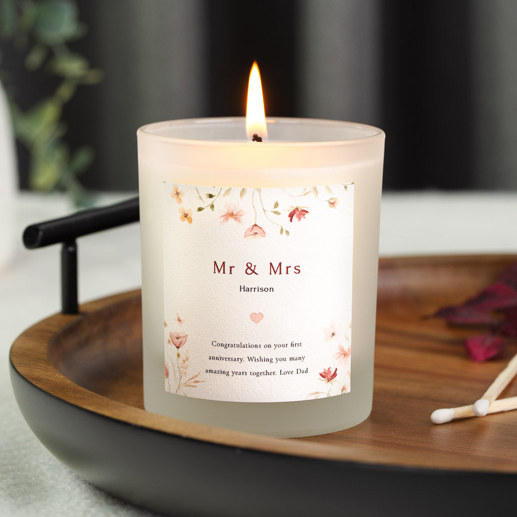 Personalised anniversary candle with a floral border and a heart beneath Mr and Mrs