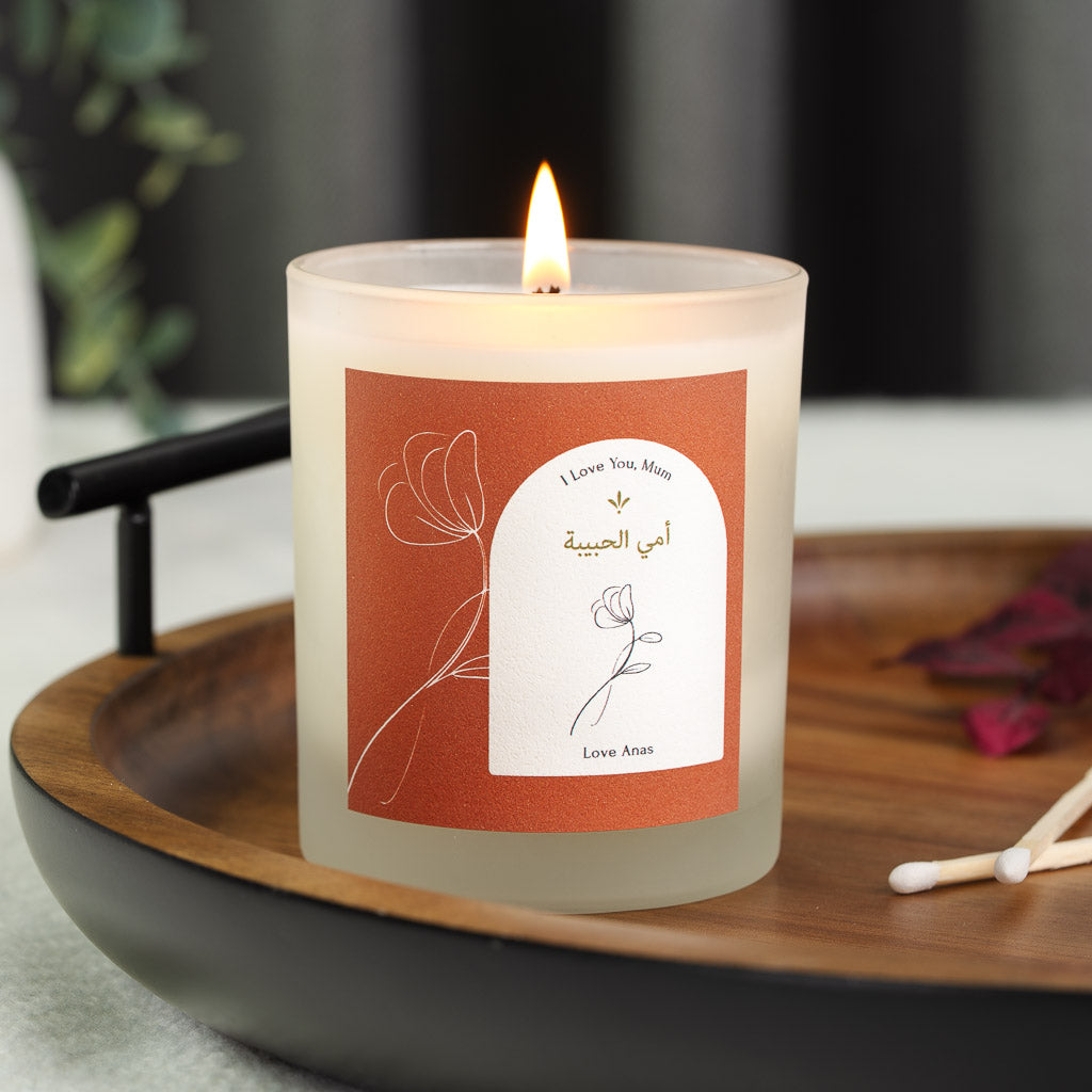 Fine line flower down a terracotta panel on a personalised Islamic Mother's Day candle