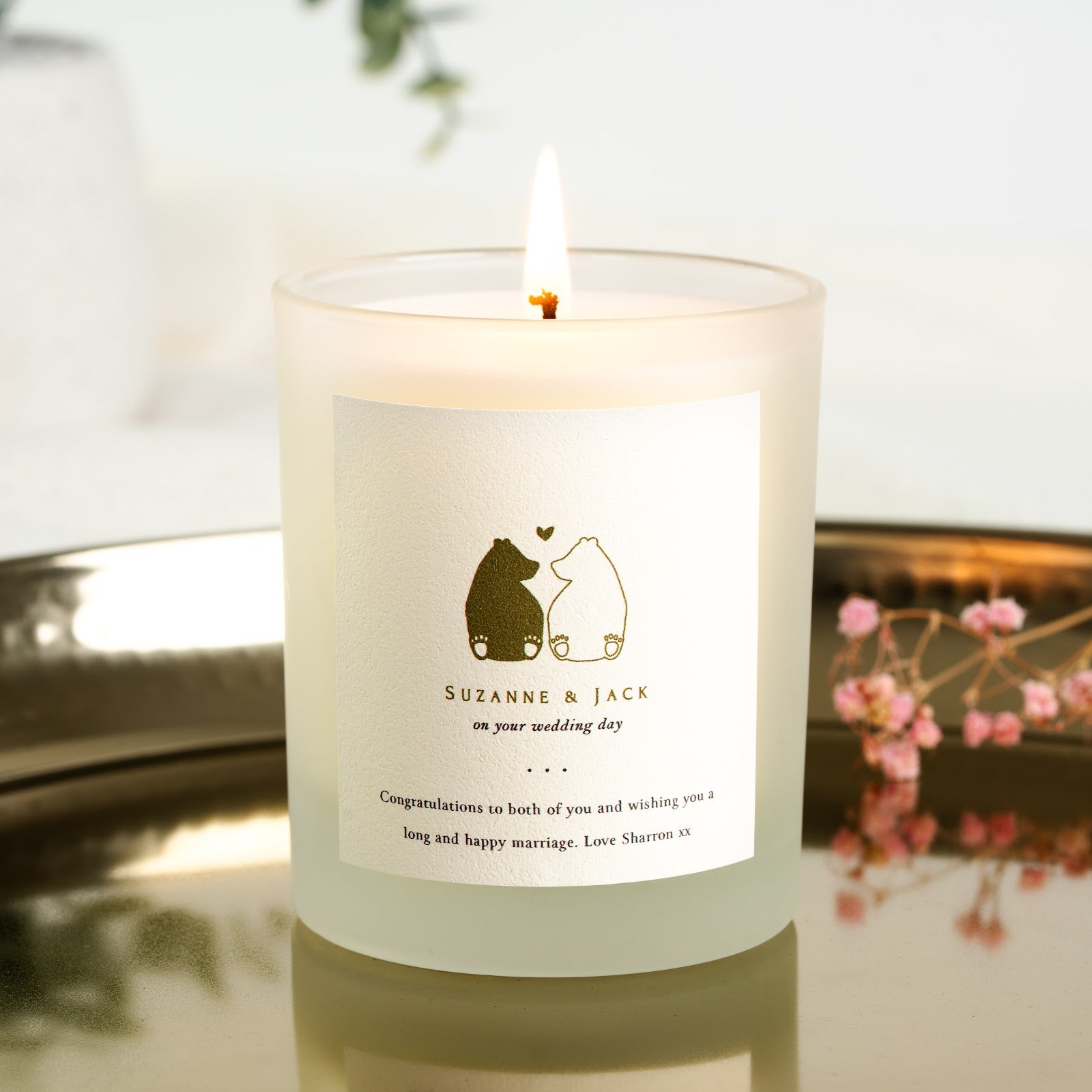Personalised wedding candle with two gold-toned bears sitting back to back beneath a small heart